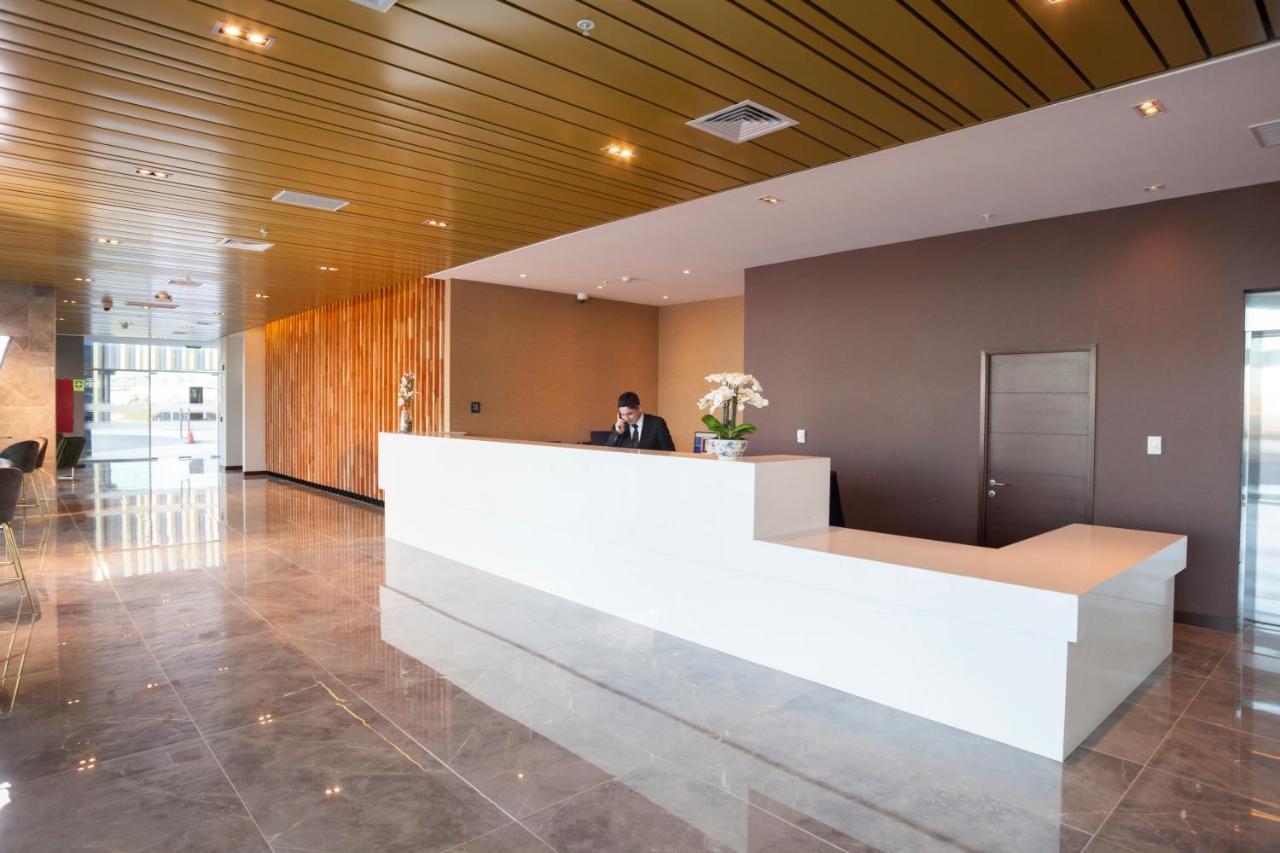 Mds Hotel Чильян Экстерьер фото Reception desk at the airport