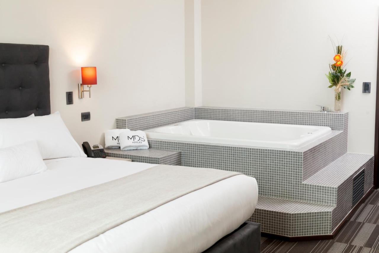 Mds Hotel Чильян Экстерьер фото A whirlpool tub in a hotel room